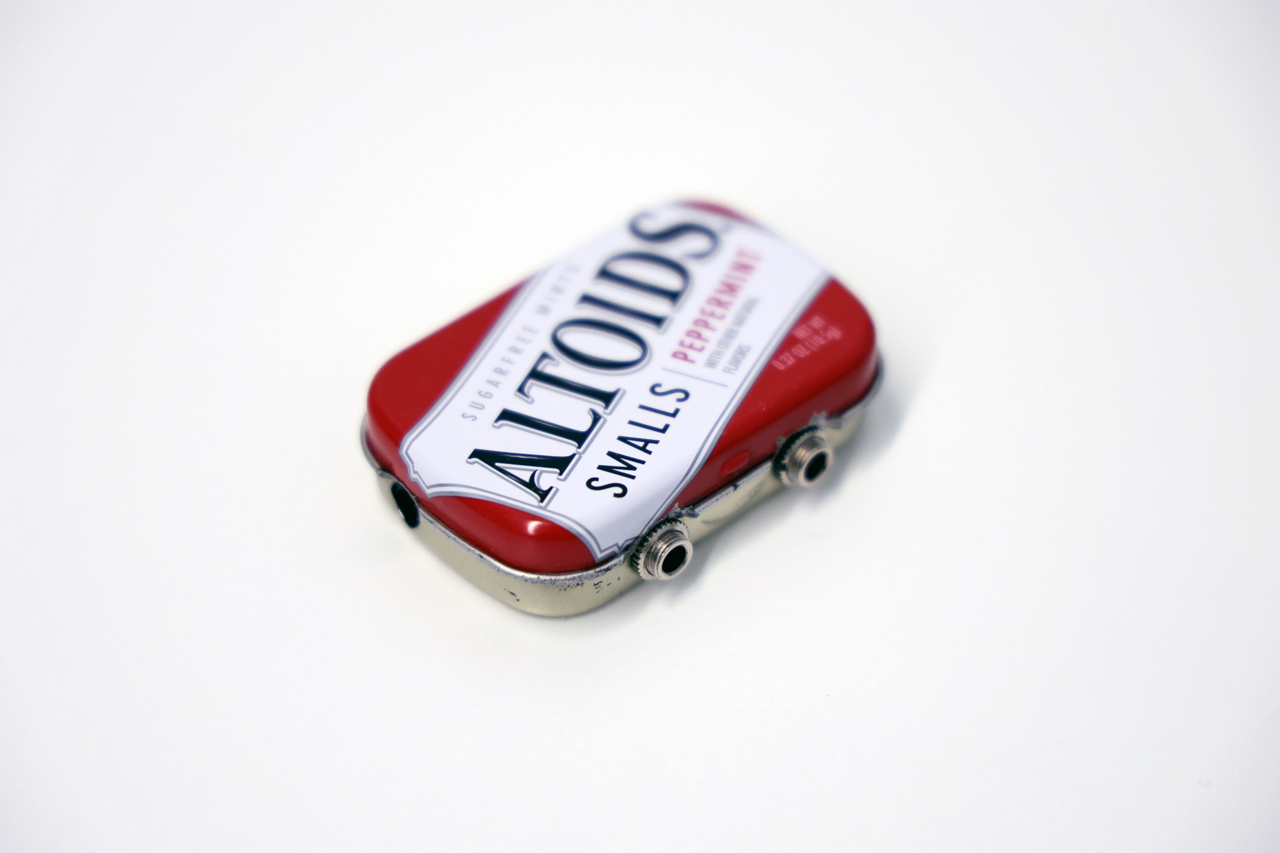Original prototype amplifier housed in a closed Altoids tin.